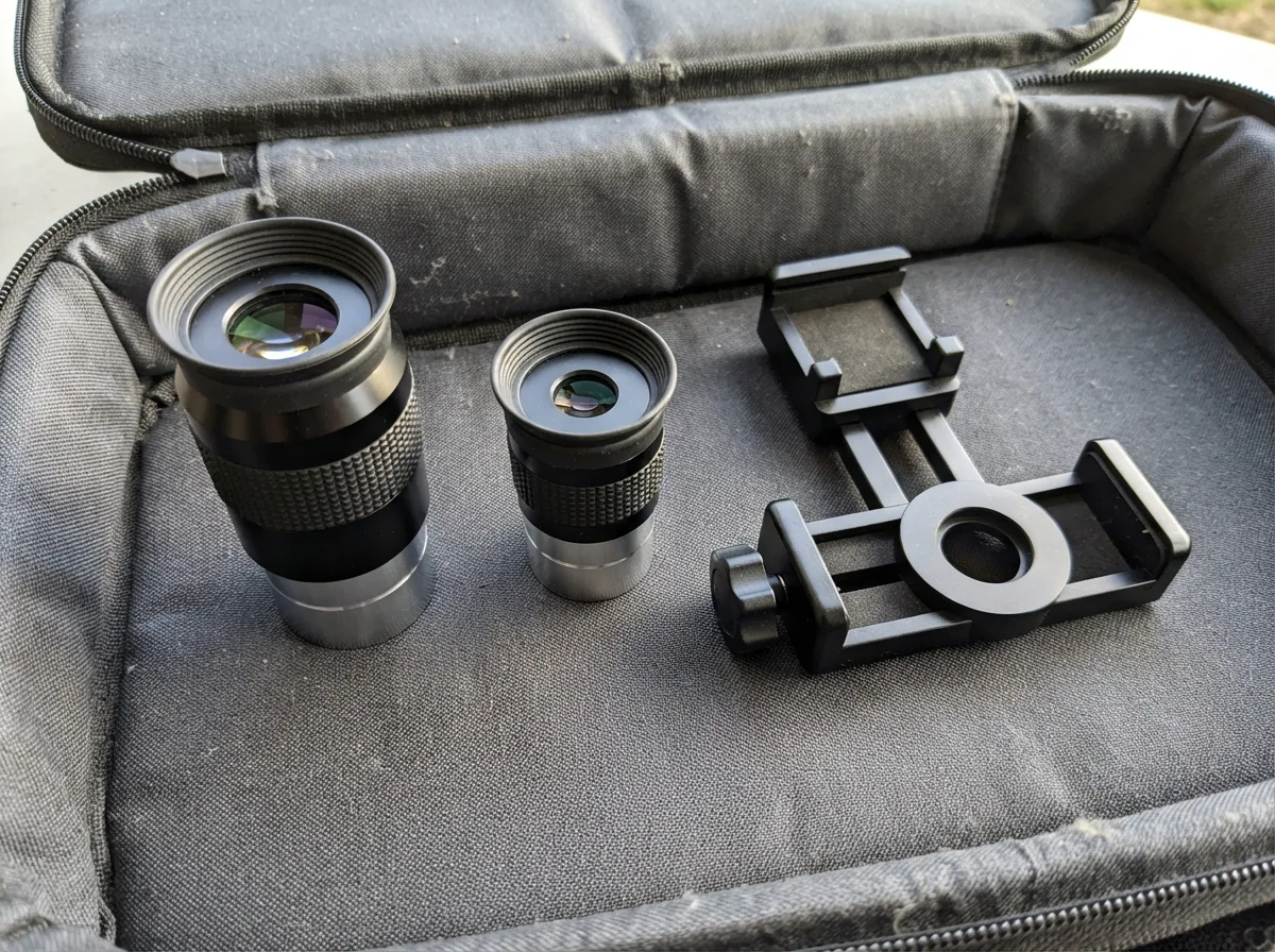 Two quality Plossl eyepieces and a smartphone adapter included with the Orion telescope.